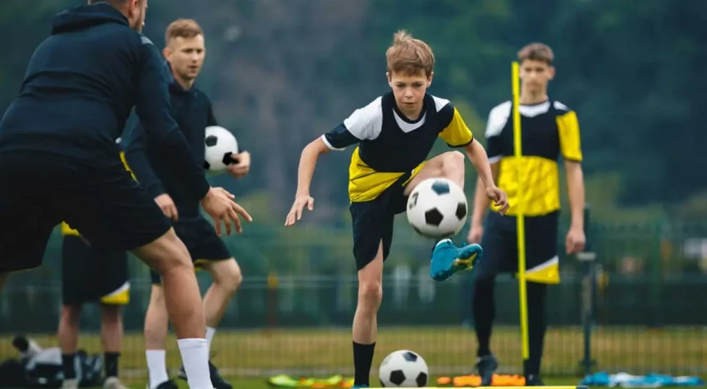 young player practices a dribble